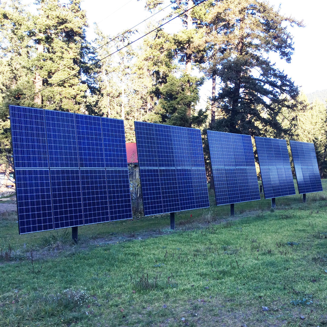 Five ground-mounted solar panels in a 2x3 setup for optimal sunlight exposure